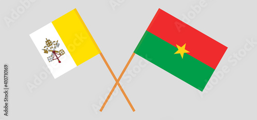 Crossed flags of Vatican and Burkina Faso