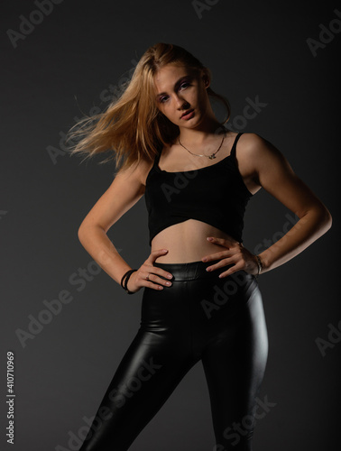 Sexy blonde in leather black pants going crazy.