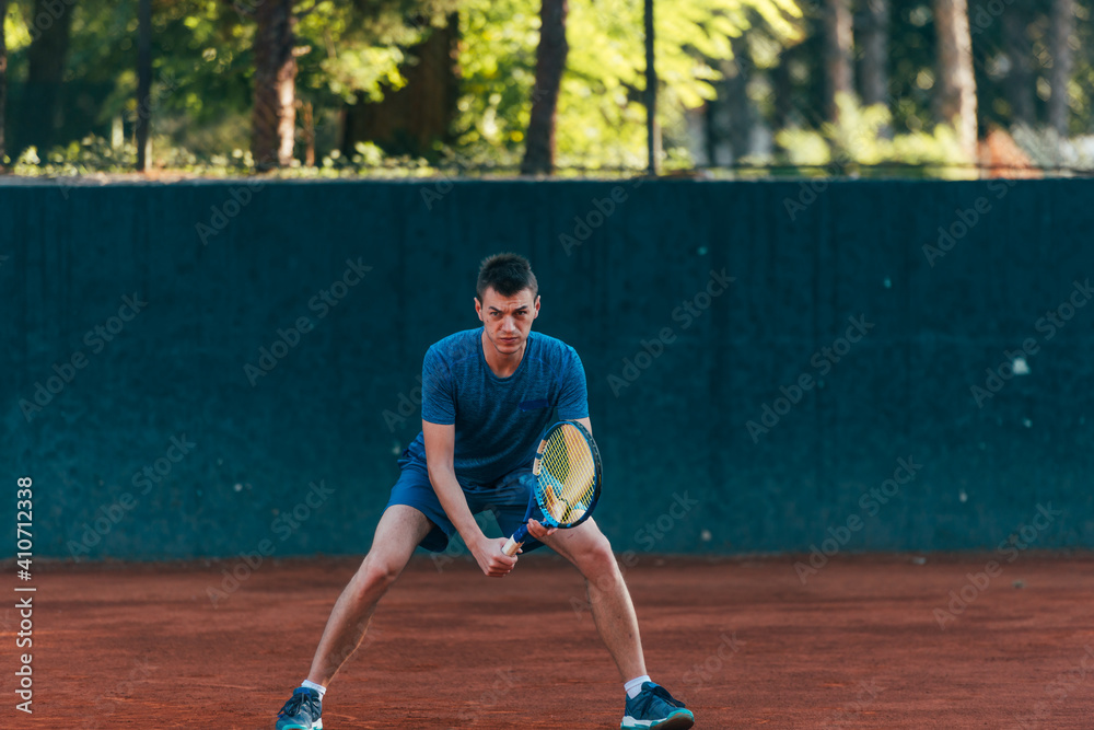 Focused male athlete waiting to receive the ball in a professional tennis game