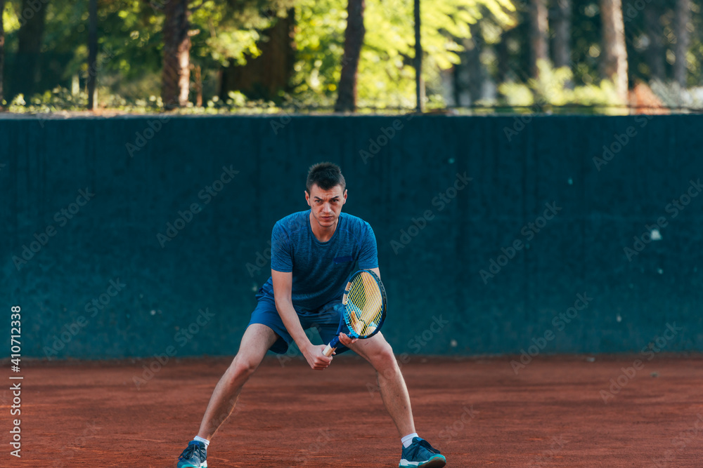 Focused male athlete waiting to receive the ball in a professional tennis game Focused male athlete waiting to receive the ball in a professional tennis game