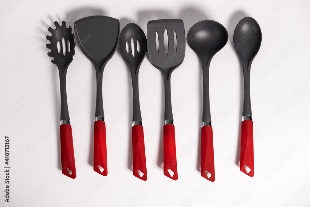 Stand with set of kitchen utensils. Isolated on a white background Stand with set of kitchen utensils. Isolated on a white background