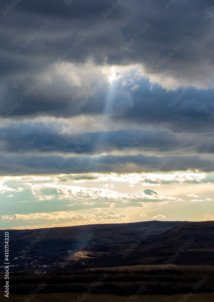 a ray of sunshine through the clouds