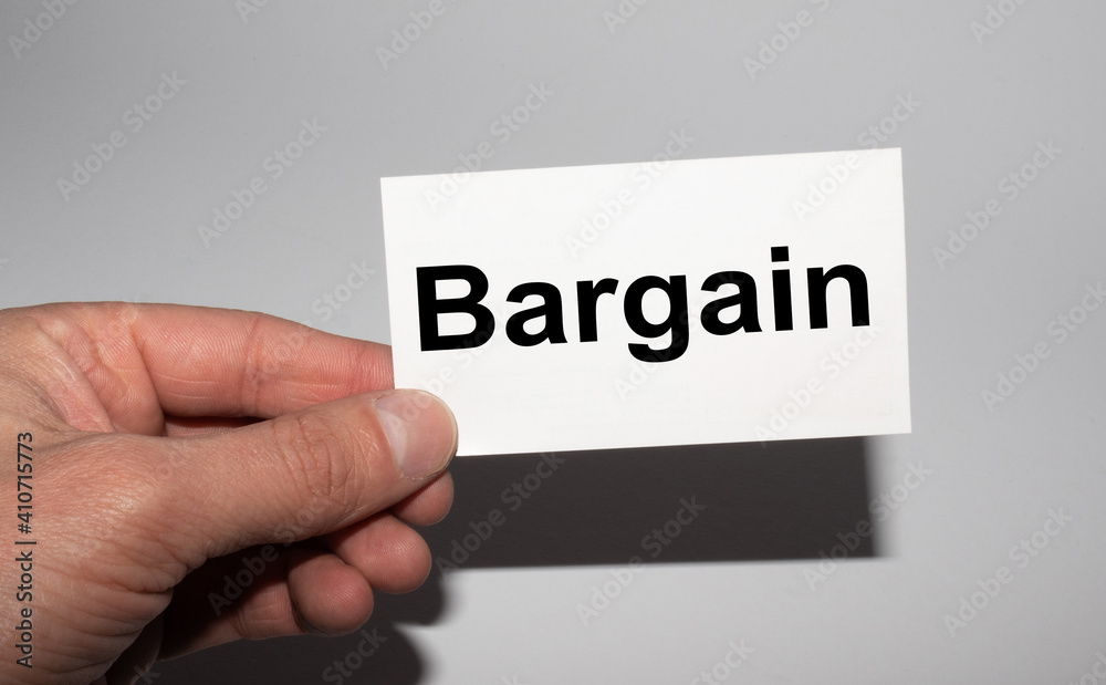 Message on the card Bargain in hands of businessman. Message on the card Bargain in hands of businessman.