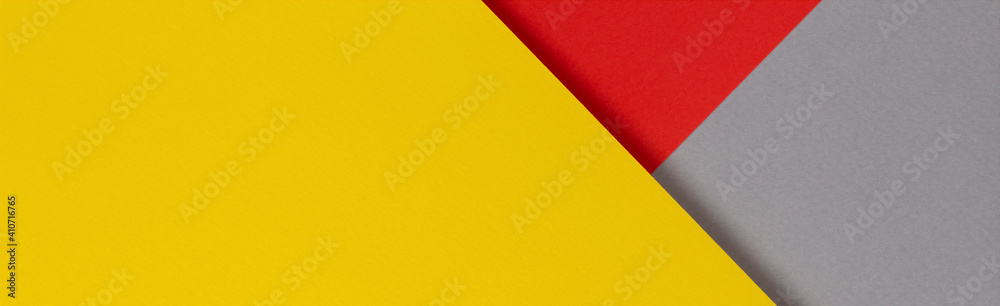 Creative abstract yellow, red and gray color geometric paper compositon background, top view Creative abstract yellow, red and gray color geometric paper compositon background, top view
