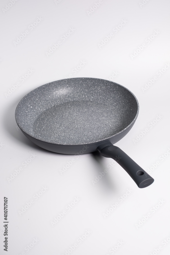 gray frying pan isolated on a white background gray frying pan isolated on a white background
