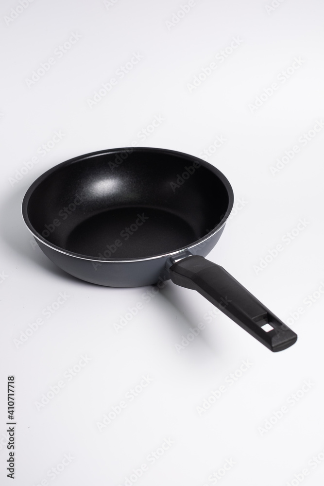 black frying pan isolated on a white background black frying pan isolated on a white background