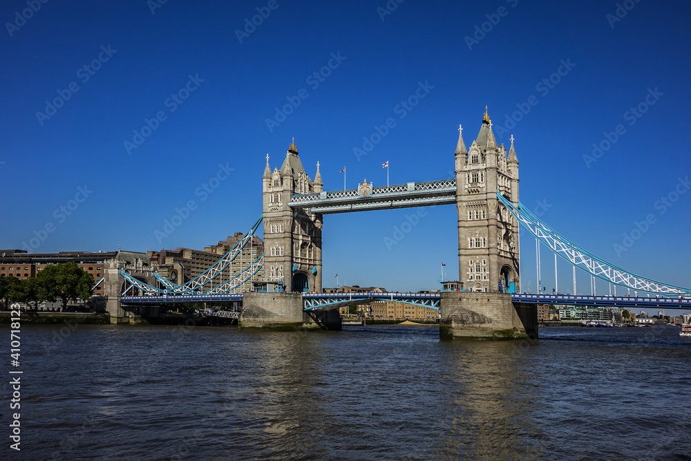 Tower Bridge over River Thames - iconic symbol of London. It is a combined bascule and suspension bridge. Tower Bridge is close to Tower of London, from which it takes its name. London, England, UK.