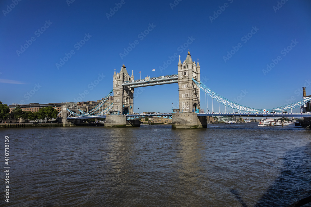 Obraz premium Tower Bridge over River Thames - iconic symbol of London. It is a combined bascule and suspension bridge. Tower Bridge is close to Tower of London, from which it takes its name. London, England, UK.