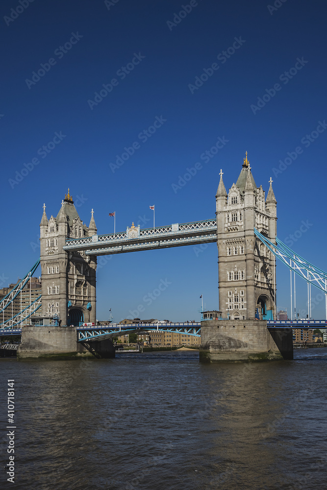 Obraz premium Tower Bridge over River Thames - iconic symbol of London. It is a combined bascule and suspension bridge. Tower Bridge is close to Tower of London, from which it takes its name. London, England, UK.
