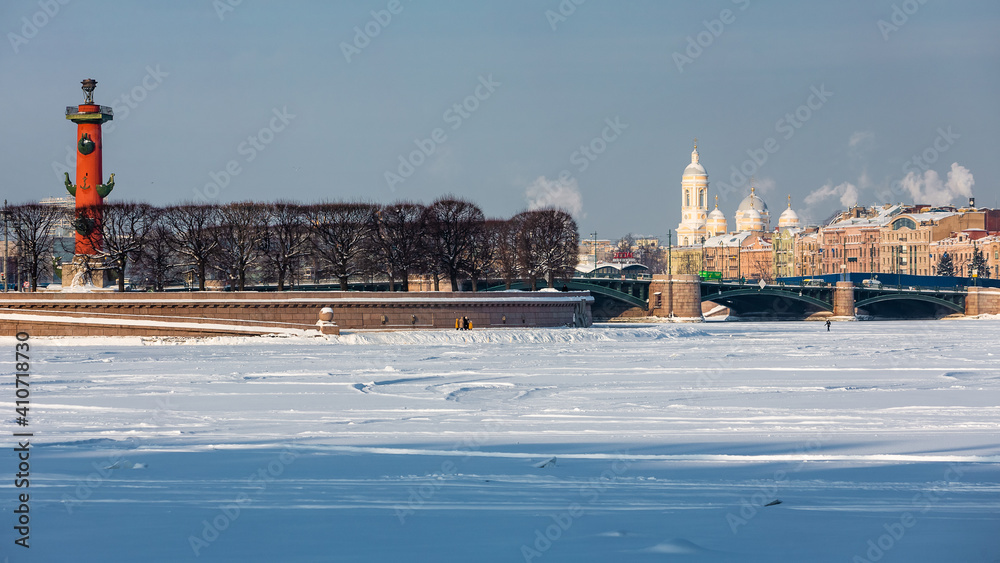 Roman-style columns - Rostralnaya Kolonna on Vasilyevsky island. Sights of St. Petersburg. Winter in the city on the Neva in Russia