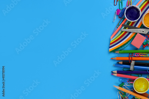 school or creative stationery with space for text on a blue background