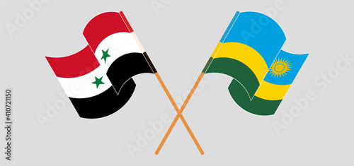 Crossed and waving flags of Syria and Rwanda