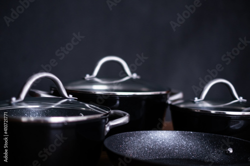 Set of grill pans on wooden table background