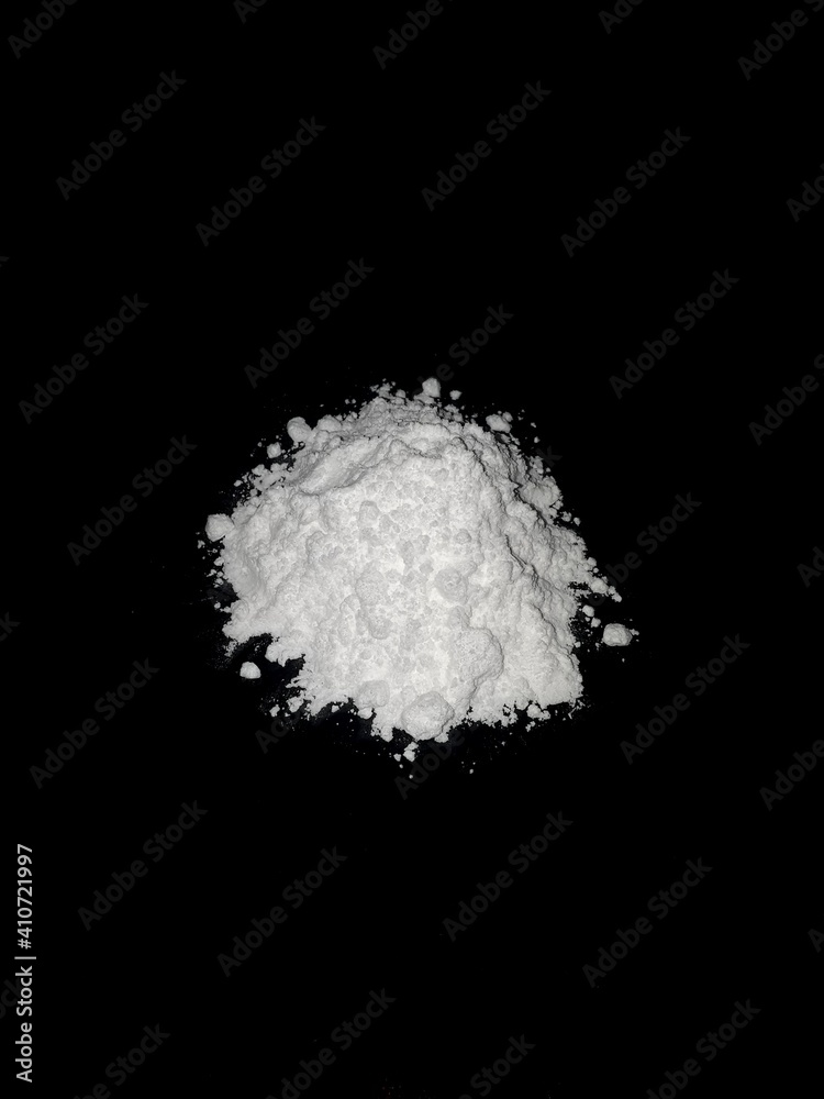 Cocaine drug powder on black background