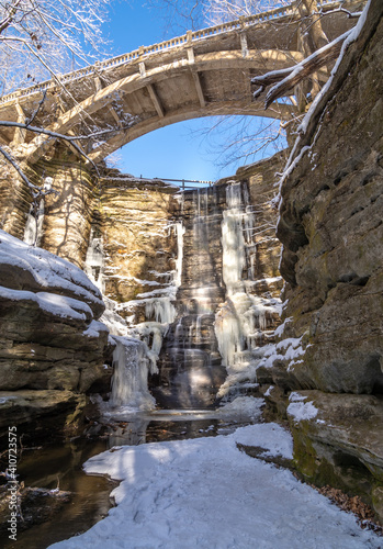 Lake Falls waterfall frozen on a cold winter day.  Matthiessen state park, Illinois, USA. photo