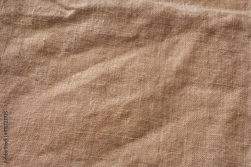 Cotton Burlap Cloth Fabric Background. Brown Hessian Jute Textile Napkin. Natural Organic Linen Tablecloth On Table.