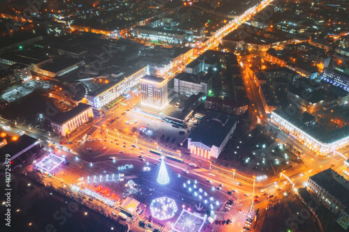 Gomel, Belarus. Main Christmas Tree And Festive Illumination On Lenin Square In Homel. New Year In Belarus. Aerial Night View