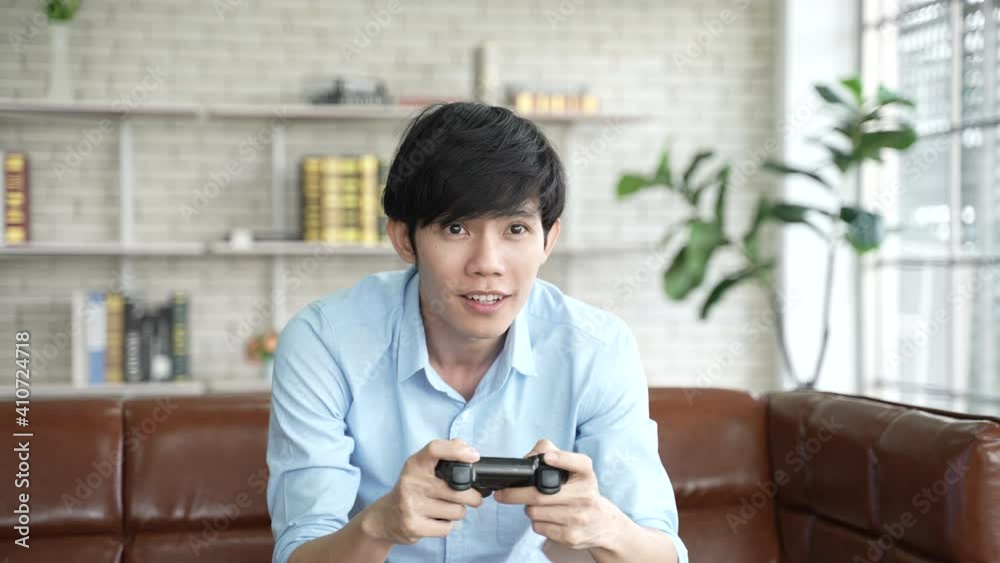 young worker man relaxing time with playing a video game on a joystick, watching the game, digital cyber device technology young worker man relaxing time with playing a video game on a joystick, watching the game, digital cyber device technology