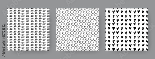 Set of hand-drawn seamless black and white patterns with dashes, circles and hearts. Vector backgrounds.