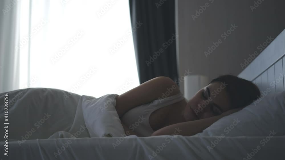 The young man and woman sleeping in the bedroom The young man and woman sleeping in the bedroom