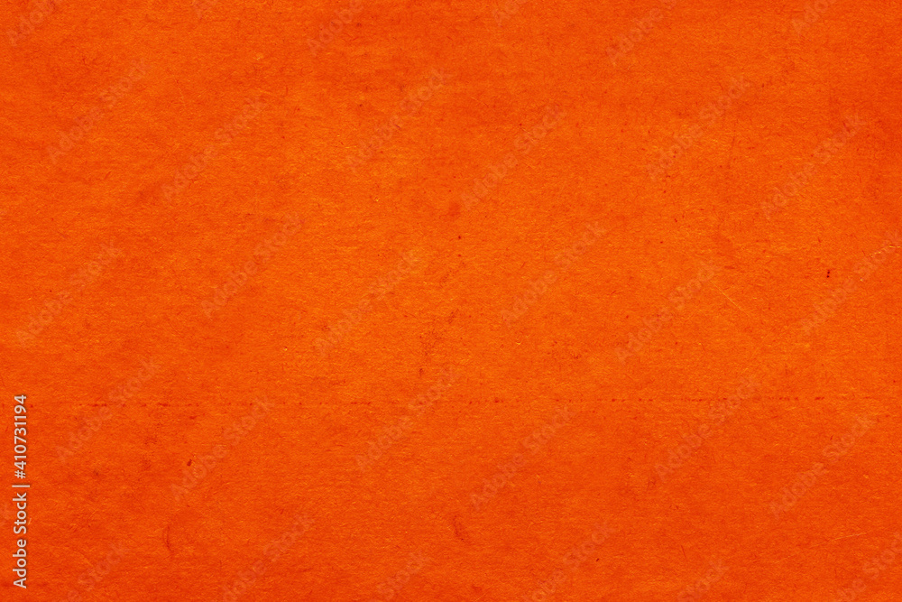 Fototapeta premium Cardboard red abstract pattern texture close-up. Retro old paper background. Grunge concrete wall. Vintage blank wallpaper.