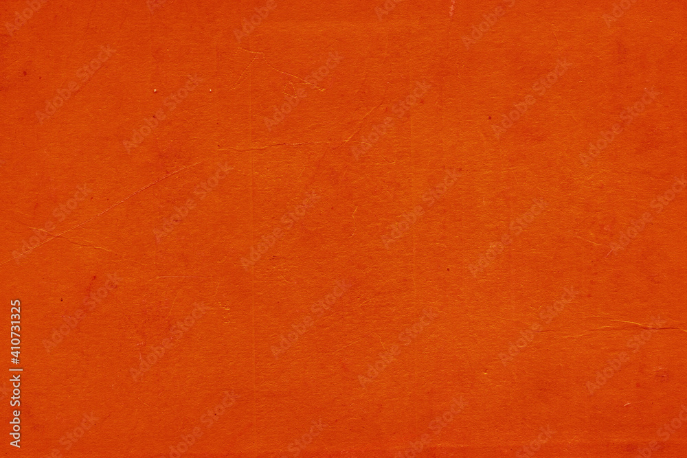 Fototapeta premium Cardboard red abstract pattern texture close-up. Retro old paper background. Grunge concrete wall. Vintage blank wallpaper.