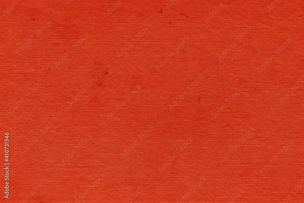 Fototapeta premium Cardboard red abstract pattern texture close-up. Retro old paper background. Grunge concrete wall. Vintage blank wallpaper.