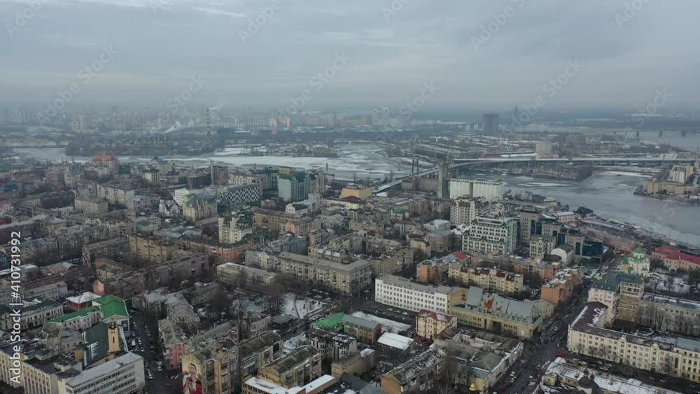 Europe, Kiev, Ukraine - February 2021: Aerial view of the Podil area, Kontraktova square. Old residential buildings overlooking the city. Europe, Kiev, Ukraine - February 2021: Aerial view of the Podil area, Kontraktova square. Old residential buildings overlooking the city.