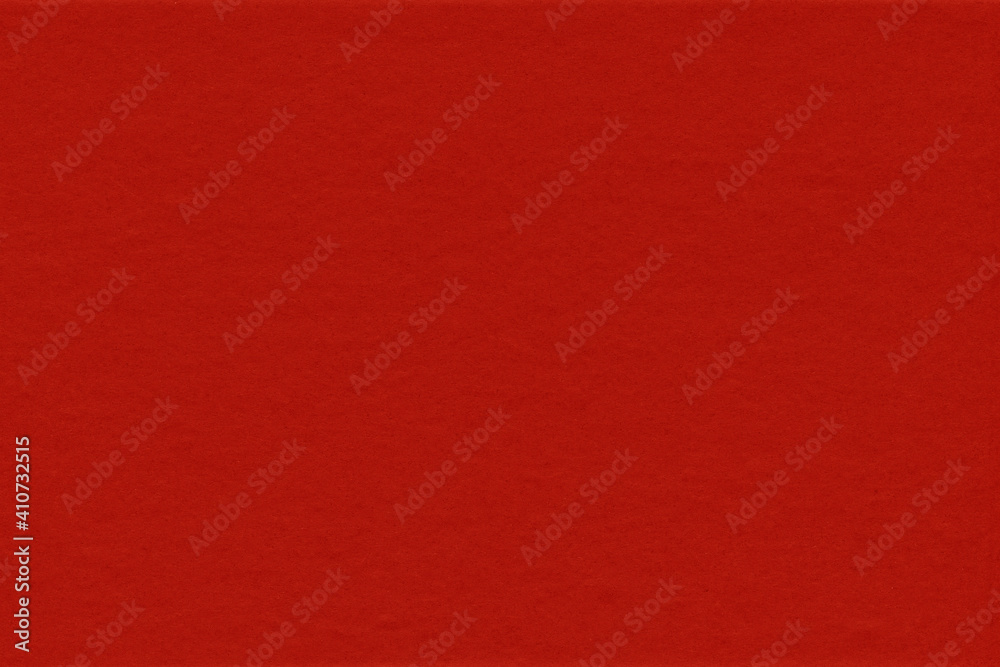 Fototapeta premium Cardboard red abstract pattern texture close-up. Retro old paper background. Grunge concrete wall. Vintage blank wallpaper.