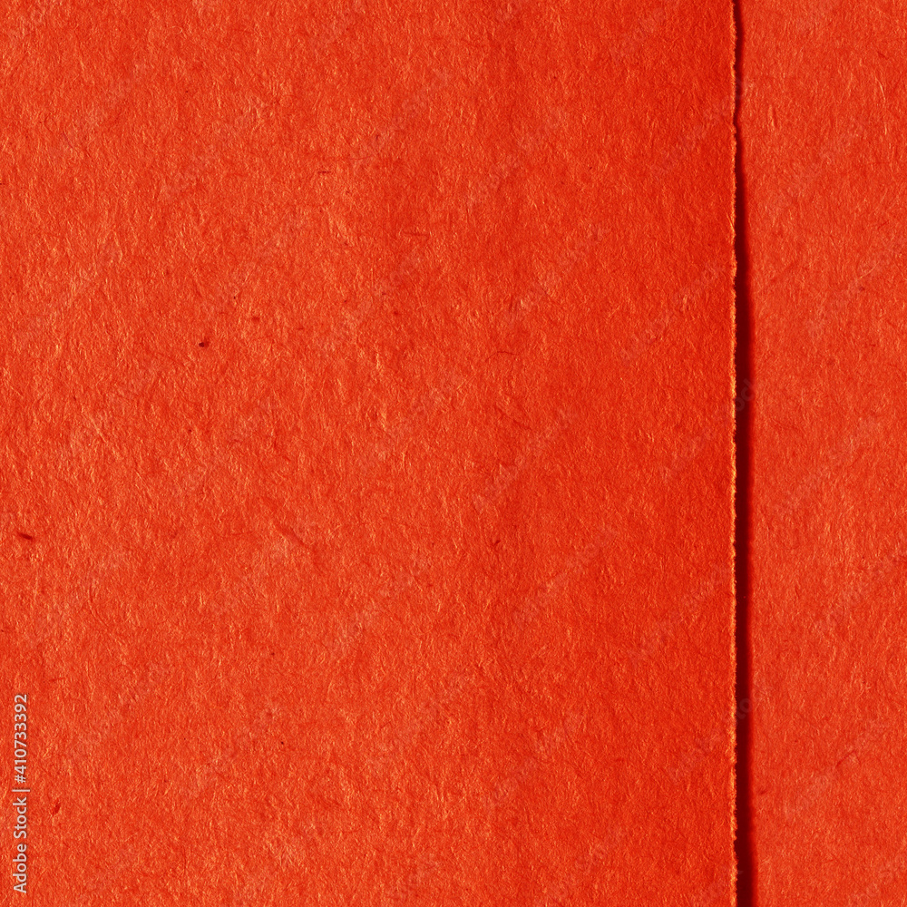 Fototapeta premium Cardboard red abstract pattern texture close-up. Retro old paper background. Grunge concrete wall. Vintage blank wallpaper.