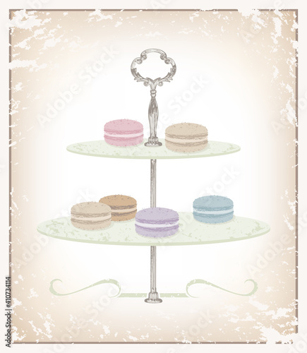 A variety of macaron desserts on a serving dish made of textures and soft colors
