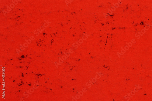 Cardboard red abstract pattern texture close-up. Retro old paper background. Grunge concrete wall. Vintage blank wallpaper. © artistmef