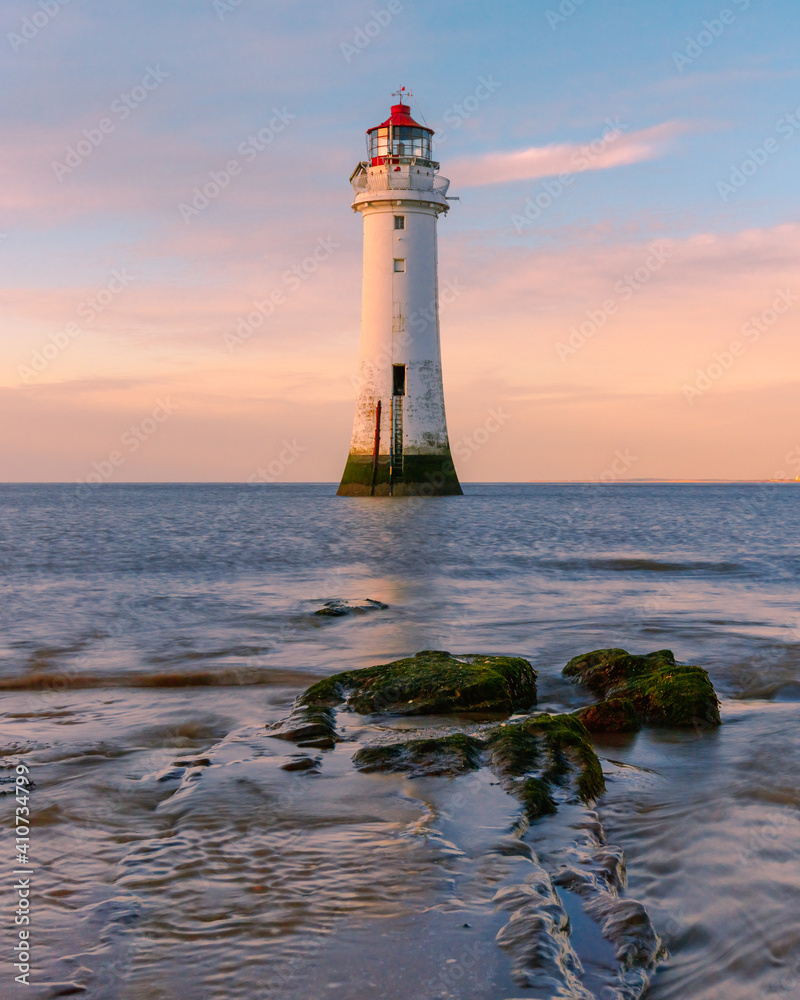 Naklejka premium lighthouse at sunset