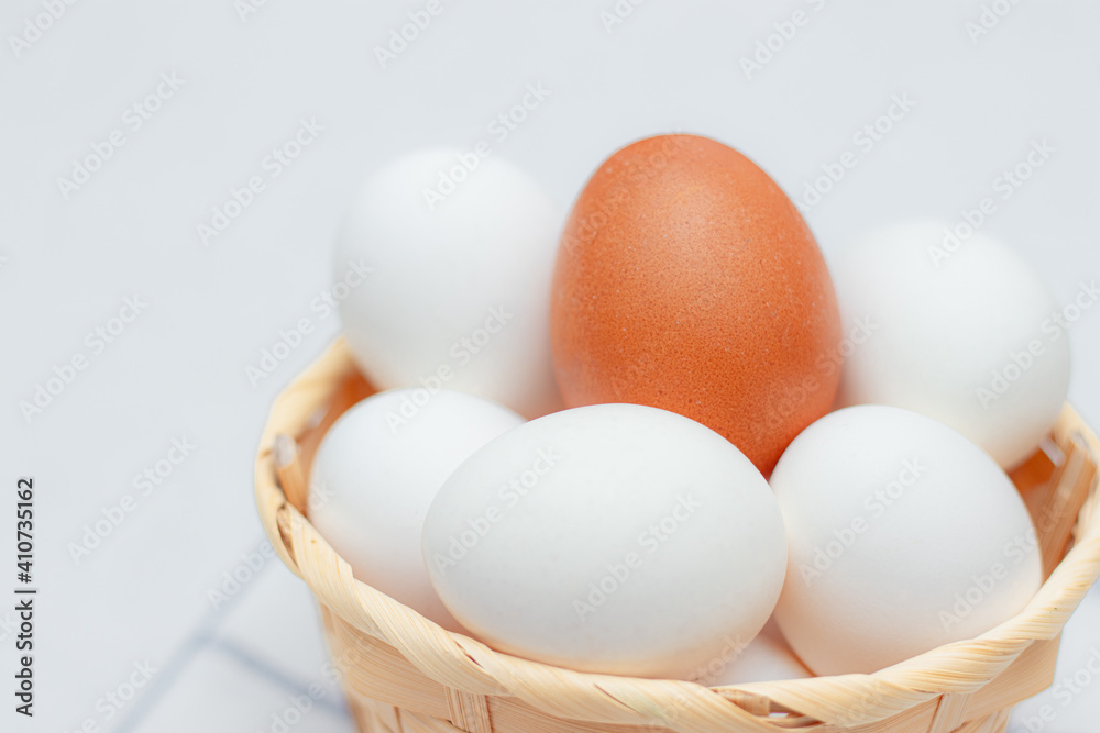 chicken eggs on a checked kitchen towel on a light table. concept of farm products and natural food. Article about home products. Fresh chicken eggs . chicken eggs on a checked kitchen towel on a light table. concept of farm products and natural food. Article about home products. Fresh chicken eggs .