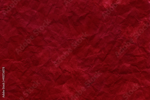 Cardboard red abstract pattern texture close-up. Retro old paper background. Grunge concrete wall. Vintage blank wallpaper.