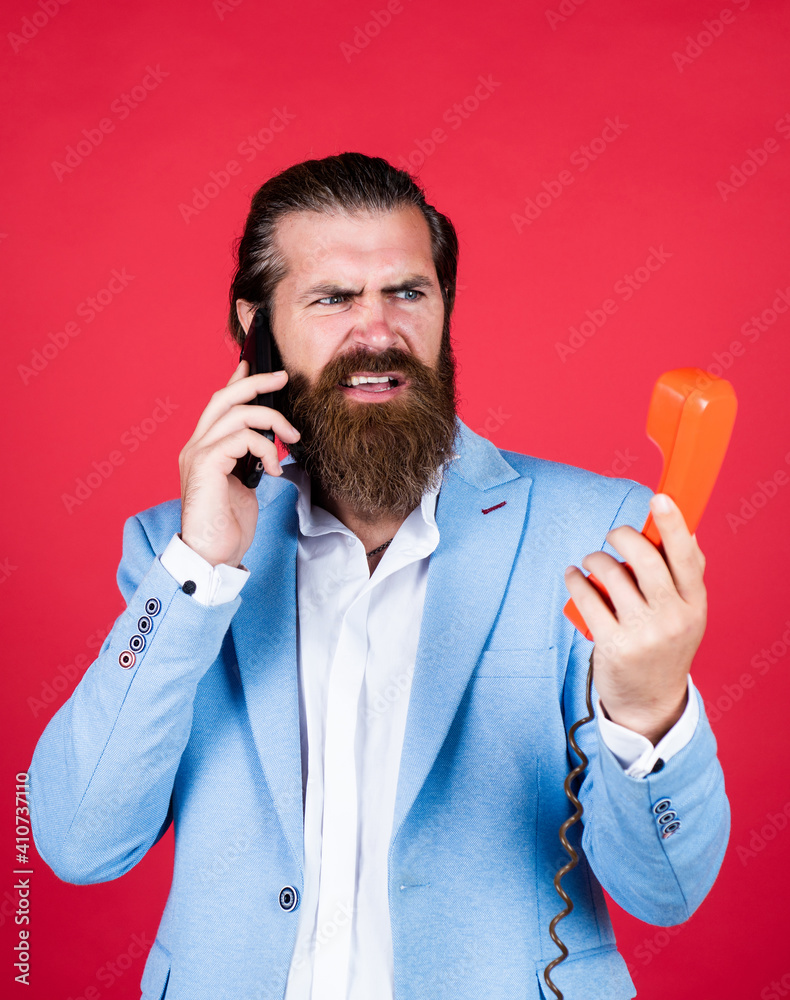 bearded hipster use retro telephone. communication concept. brutal handsome man with moustache speak on smartphone. call and conversation. modern and vintage technology. Get enlightened bearded hipster use retro telephone. communication concept. brutal handsome man with moustache speak on smartphone. call and conversation. modern and vintage technology. Get enlightened