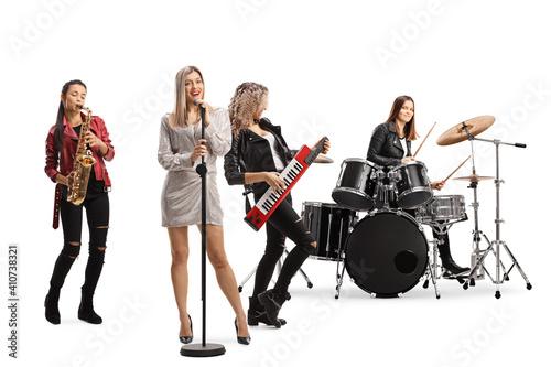 Female rock band with a drummer, sax player, keytar player and a front singer photo