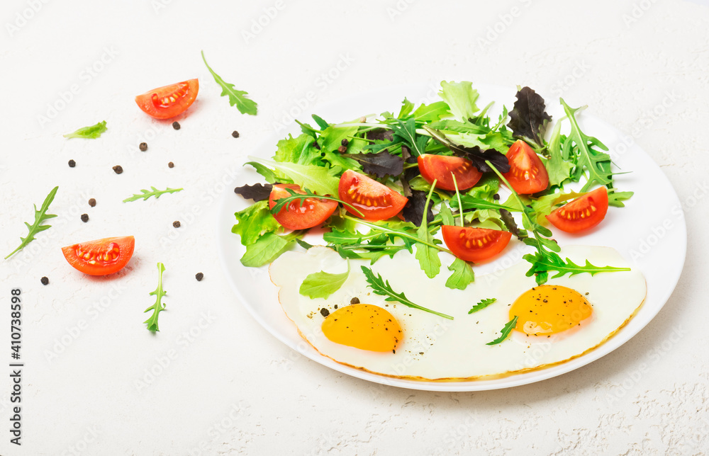 Breakfast - fried eggs and fresh vegetables. Top view Breakfast - fried eggs and fresh vegetables. Top view