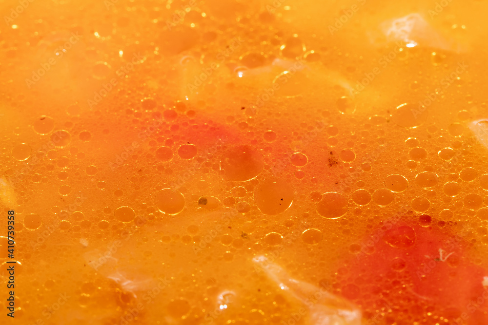 Abstract background - drops of oil on the surface of the soup