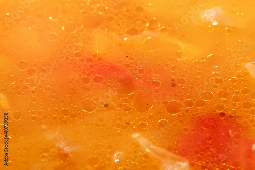 Abstract background - drops of oil on the surface of the soup