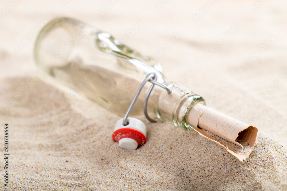 letter in a glass bottle on sea sand. Message written and sent in the distant past. A valuable find on the beach. letter in a glass bottle on sea sand. Message written and sent in the distant past. A valuable find on the beach.