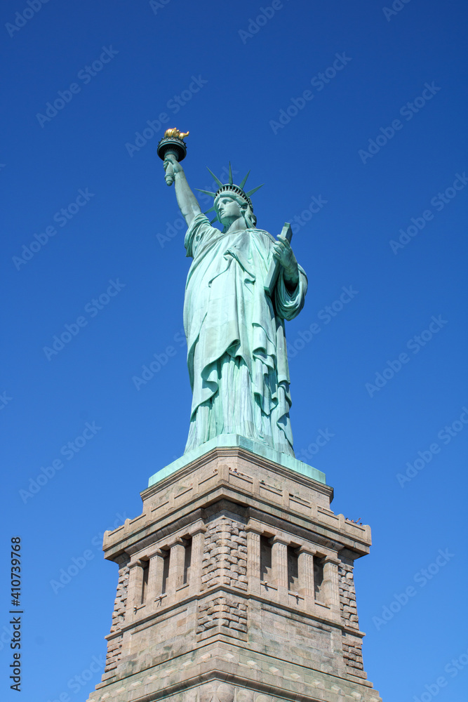 Portrait view of the Statue of Liberty in New York City.