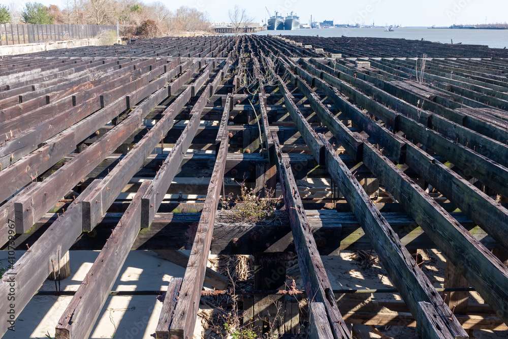 Skeletal remains of a wharf along the Mississippi River near Crescent Park in New Orleans, Louisiana, USA
