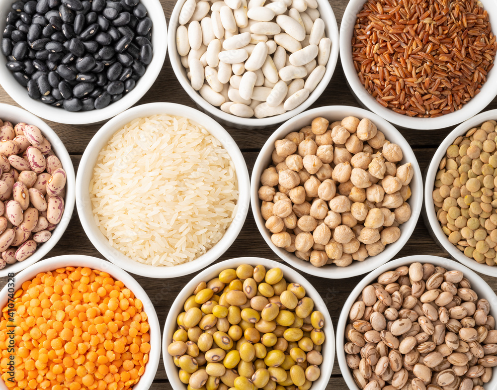 Assorted beans and grains on white bowls Assorted beans and grains on white bowls