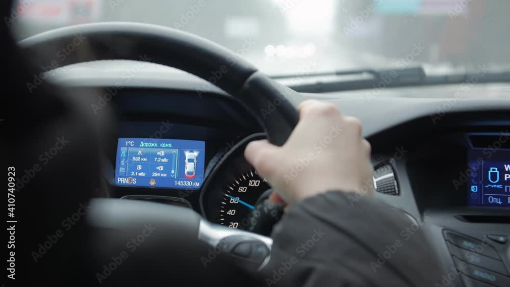 The car dashboard woman driving hand closeup The car dashboard woman driving hand closeup