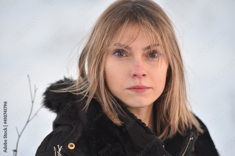 a beautiful young caucasian girl posing in the snow a beautiful young caucasian girl posing in the snow