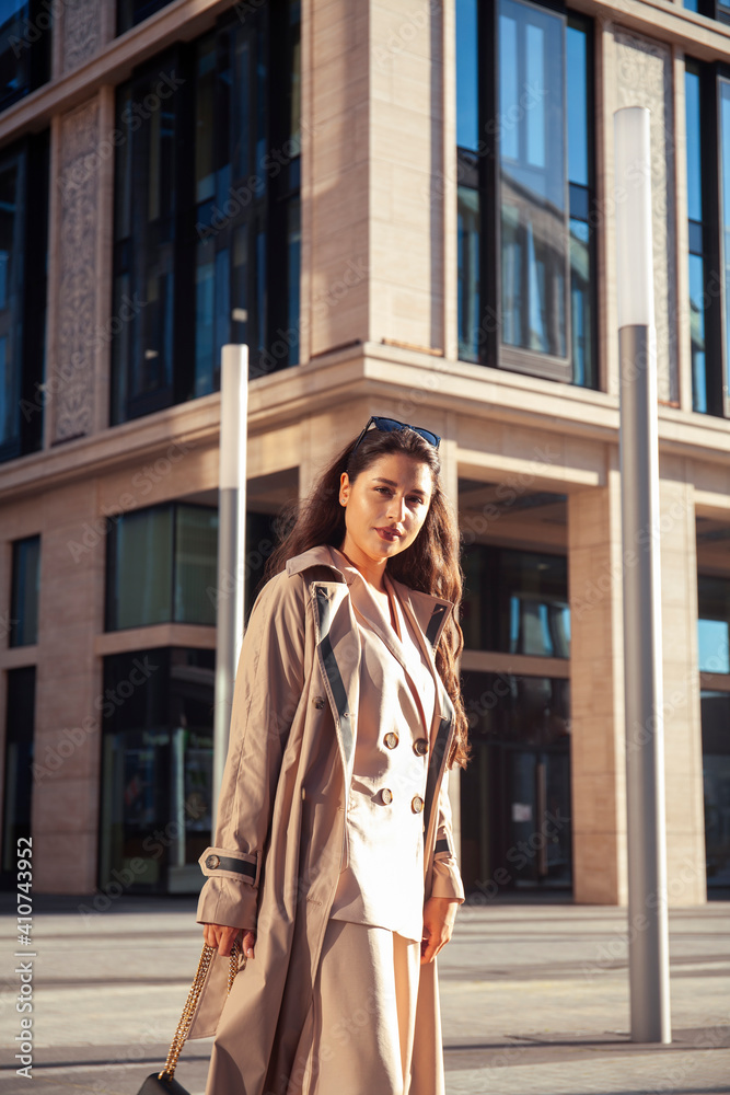 young pretty brunette woman in fashion suit at business building posing cheerful, lifestyle people concept young pretty brunette woman in fashion suit at business building posing cheerful, lifestyle people concept