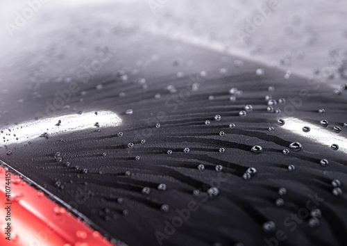 Fotografia Water drops on car paint