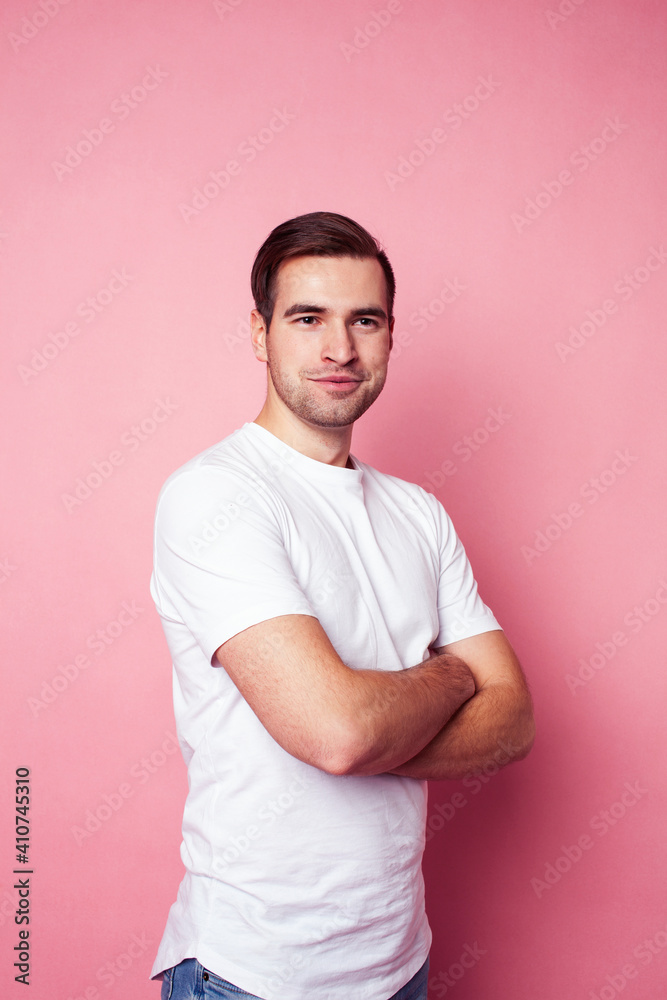 young caucasian guy in white t-shirt posing cheerful on pink background, lifestyle people concept young caucasian guy in white t-shirt posing cheerful on pink background, lifestyle people concept