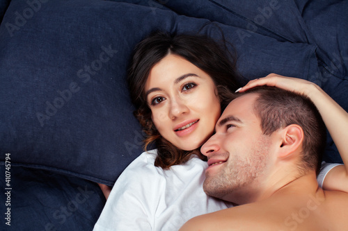 young pretty couple together in bed sleeping chill, lifestyle people concept